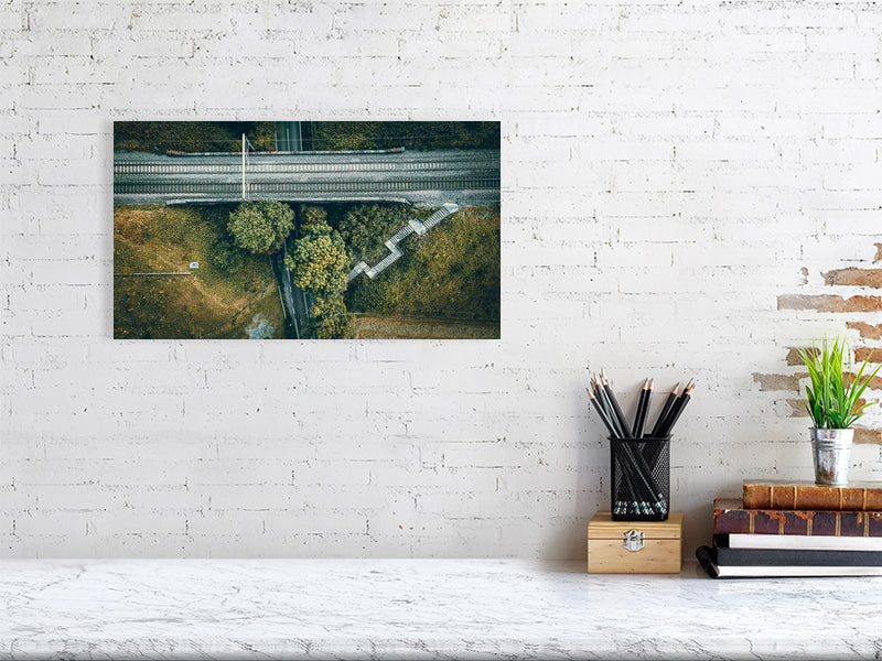 Aerial view of a small rail bridge over the road with footpath and steps leading to it. Print of Framed Photography art, wall decor.